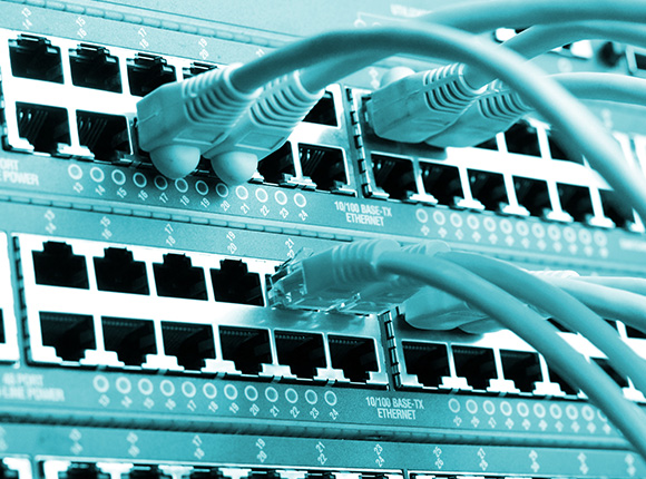 Copper and fibre network cabling connections on an Ethernet switch.