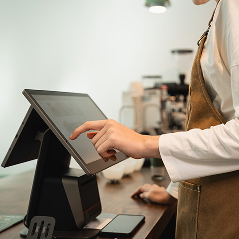 Touchscreen EPOS system in use at a commercial establishment.