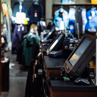 Checkout area with multiple EPOS systems in a retail environment.