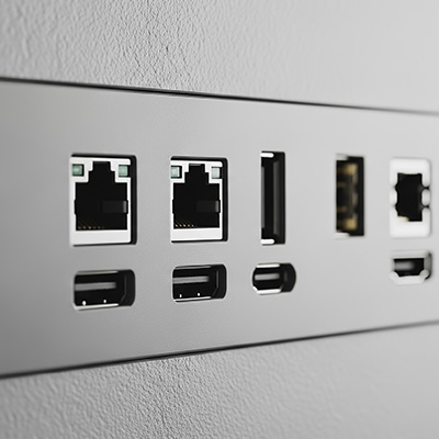 Structured cabling ports including Ethernet and USB connections on a wall panel.